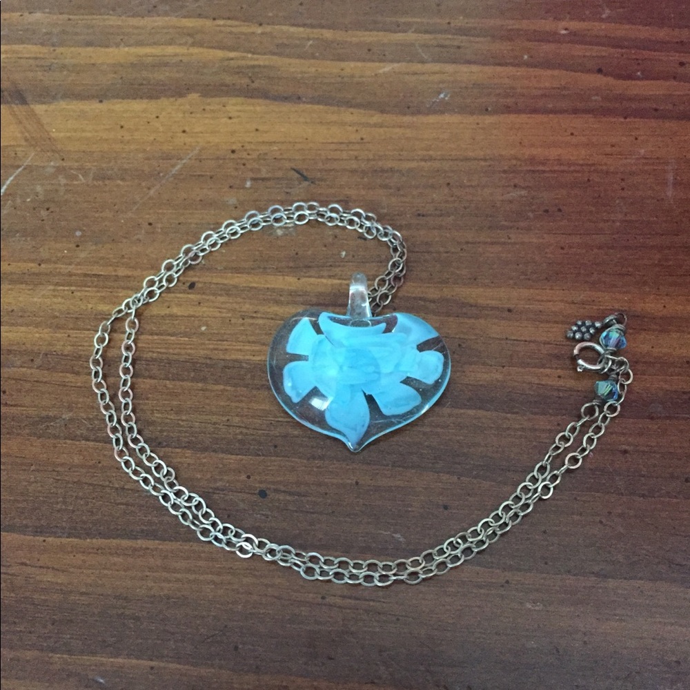 Glass heart pendant with blue flower inside